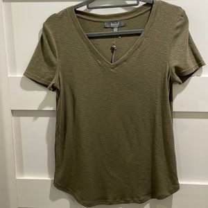 Burnt olive v neck. Never worn. Synthetic blend of cotton, modal & elastane.